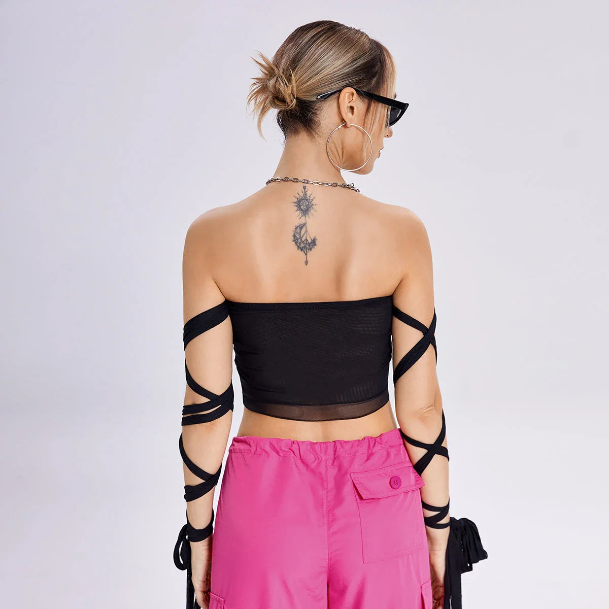 A stylish women's tank top with a trendy cross-back design and premium fabric blend for comfortable and versatile summer wear.