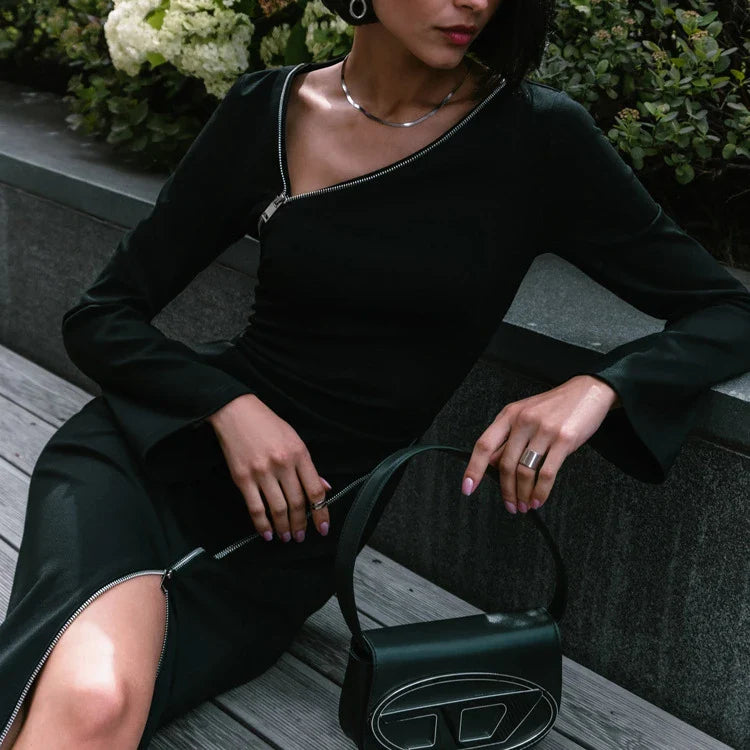 Elegant crossbody dress with zipper detail, high-waisted silhouette, and long sleeves in a solid black colour