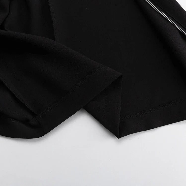 Elegant crossbody dress with zipper detail, high-waisted silhouette, and long sleeves in a solid black colour