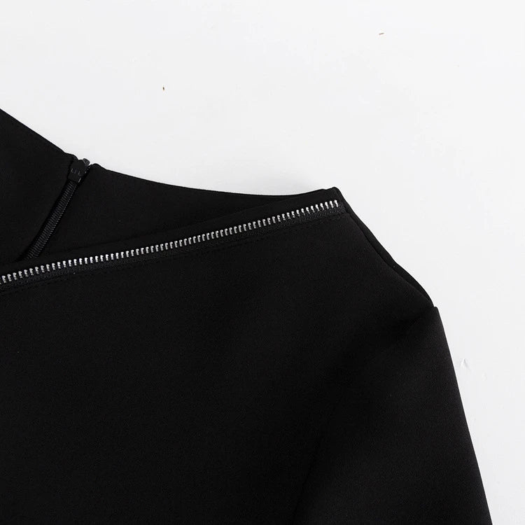 Elegant crossbody dress with zipper detail, high-waisted silhouette, and long sleeves in a solid black colour