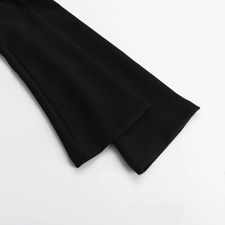 Elegant crossbody dress with zipper detail, high-waisted silhouette, and long sleeves in a solid black colour