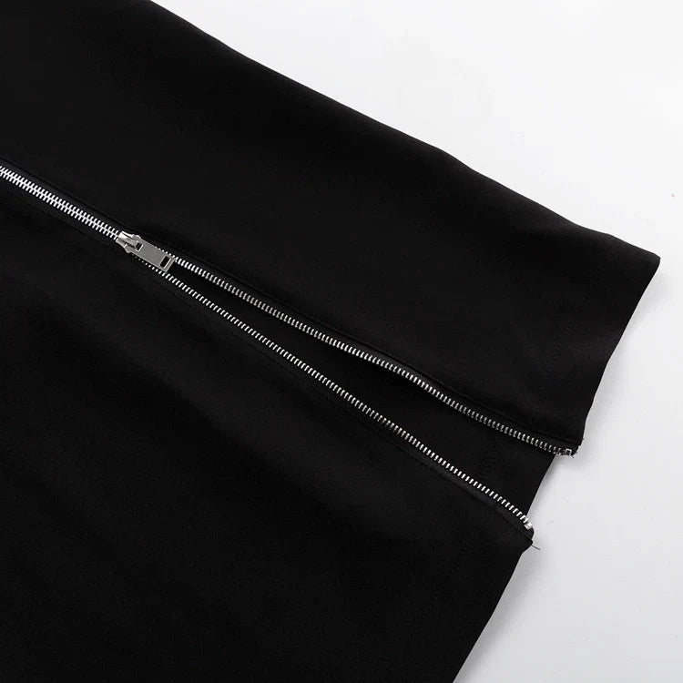 Elegant crossbody dress with zipper detail, high-waisted silhouette, and long sleeves in a solid black colour