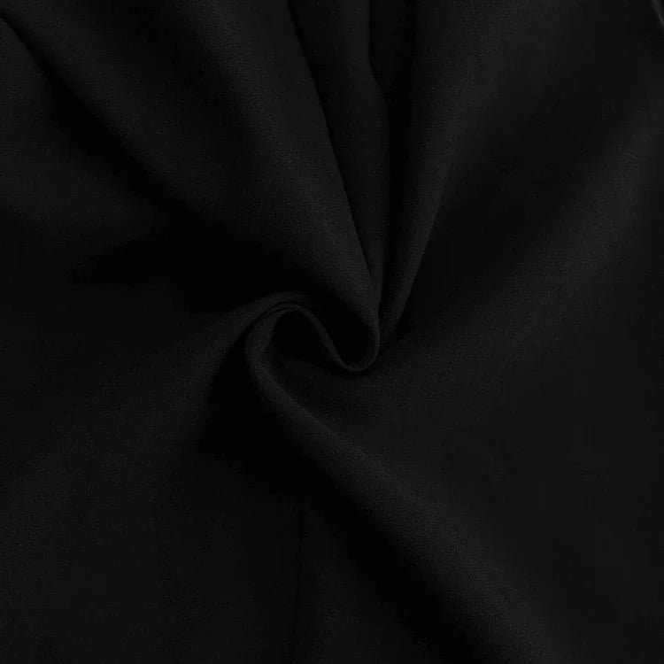 Elegant crossbody dress with zipper detail, high-waisted silhouette, and long sleeves in a solid black colour