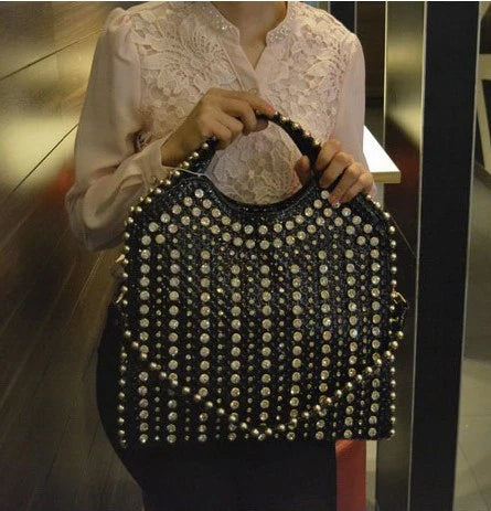 Fashionable diamond-studded messenger bag with shimmering PU leather surface, versatile carrying options, and practical organisational features