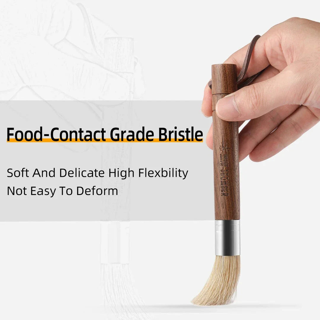 A natural fibre coffee grinder cleaning brush with a wooden handle, designed to safely remove coffee residue and maintain equipment performance.