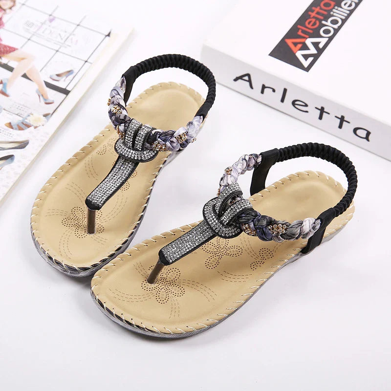Low-top toe sandals with two-layer leather upper, raw rubber sole, and rhinestone detailing