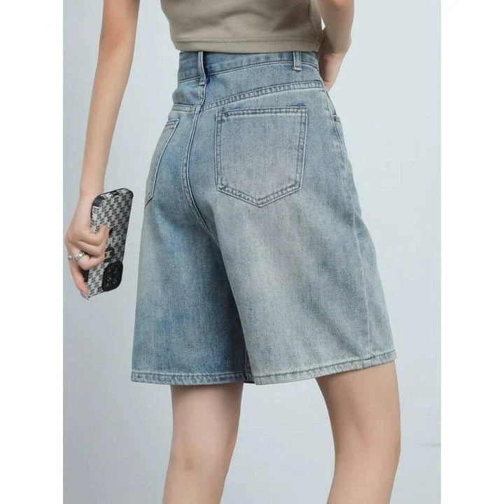 High-waist knee-length denim shorts for women, featuring a flattering silhouette and versatile casual style.