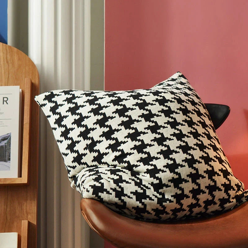 A classic houndstooth-patterned throw pillow cover made from premium 100% cotton with a high thread count for a luxurious feel.