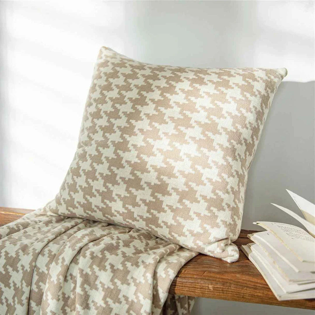 A classic houndstooth-patterned throw pillow cover made from premium 100% cotton with a high thread count for a luxurious feel.