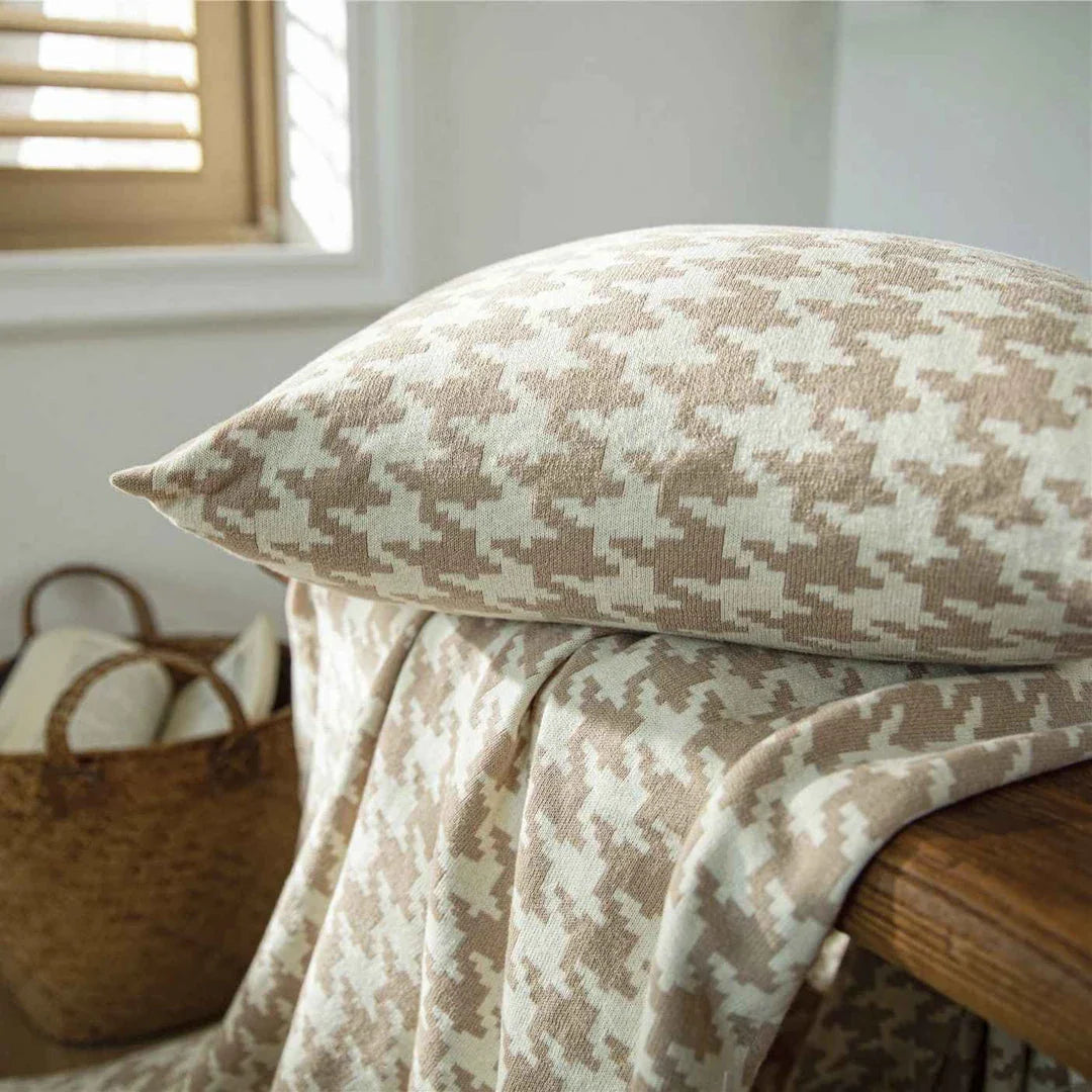 A classic houndstooth-patterned throw pillow cover made from premium 100% cotton with a high thread count for a luxurious feel.