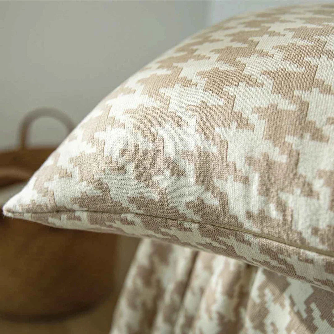 A classic houndstooth-patterned throw pillow cover made from premium 100% cotton with a high thread count for a luxurious feel.