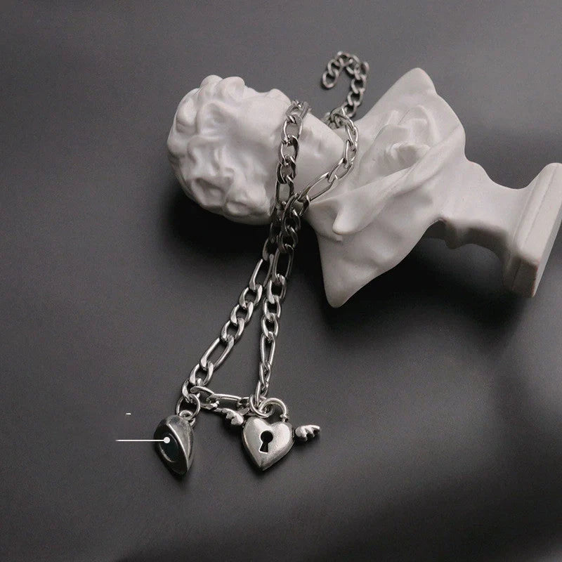 Heart-shaped couple bracelets with adjustable chain, perfect for romantic gifts.