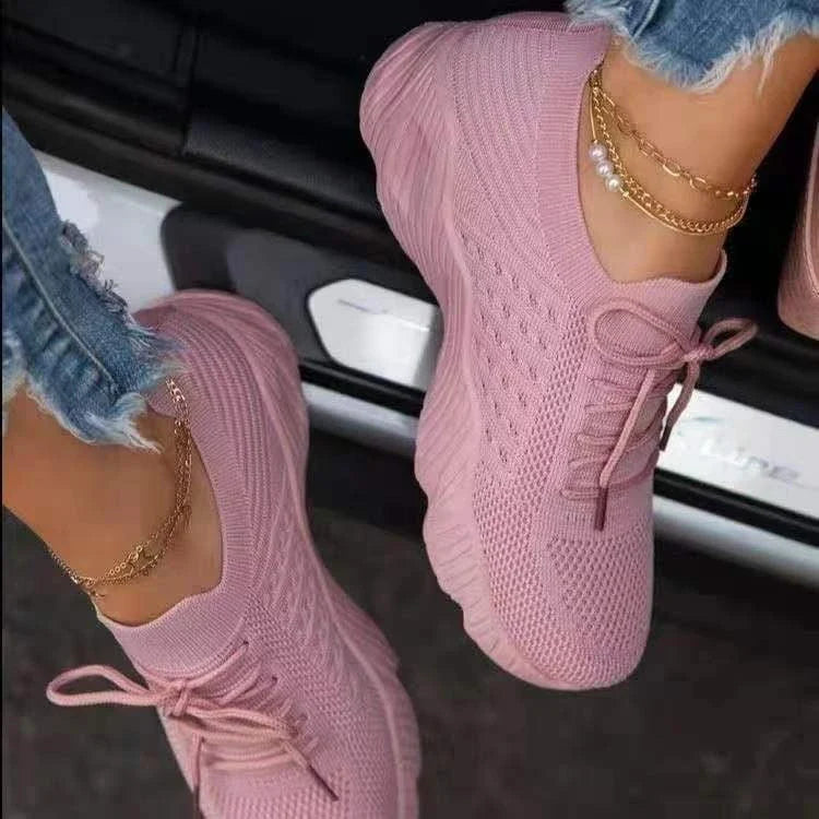 Stylish and comfortable knit sneakers for active women, featuring a breathable mesh upper, supportive design, and slip-resistant outsole.