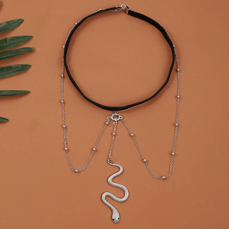 Fashionable gold beaded leg chain with snake pendant for women, featuring a captivating design and adjustable fit for comfortable wear.