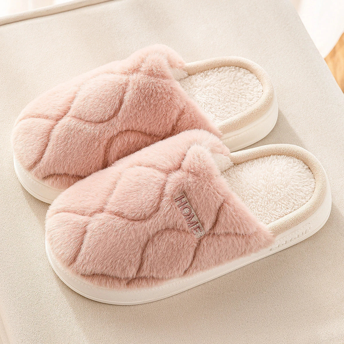 Cozy plush slippers with a soft, luxurious upper and durable PVC sole for comfortable indoor wear