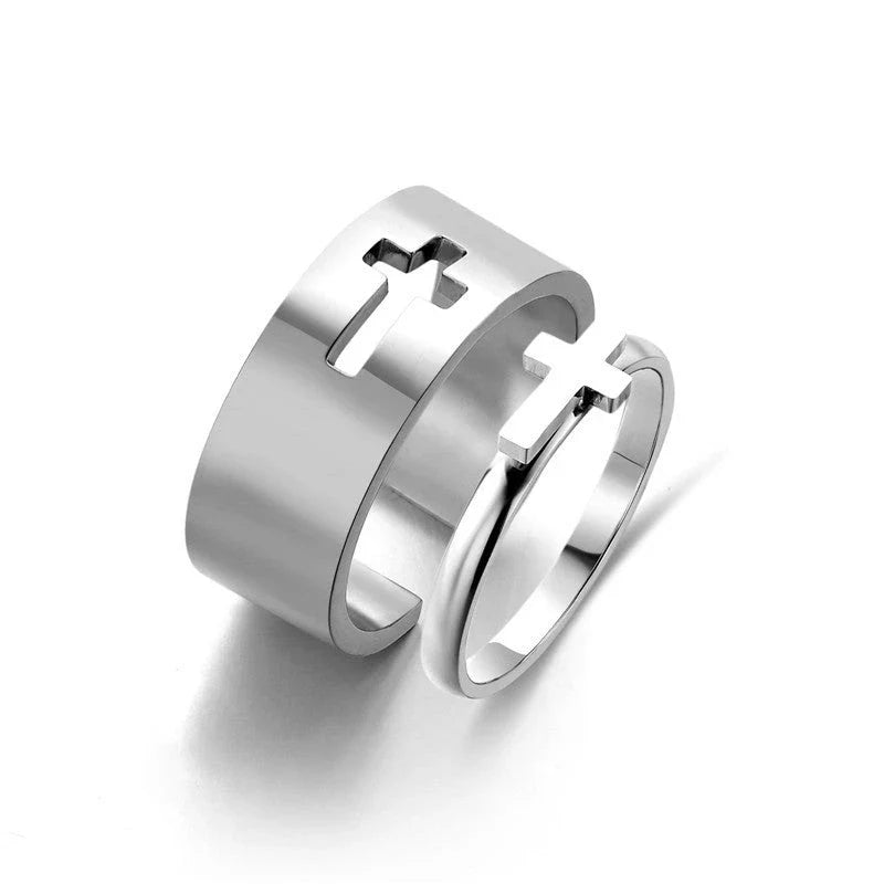 Elegant titanium steel rings in various designs including hearts, butterflies, and crosses, for a timeless and versatile accessory