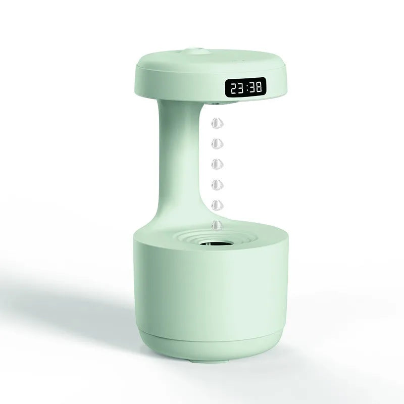 White anti-gravity humidifier showing water droplets appearing to levitate upwards from its base
