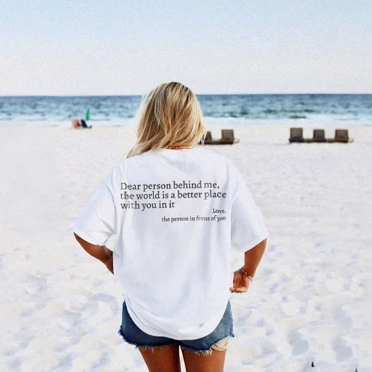 Stylish women's graphic t-shirt with trendy slogan, featuring a vibrant print design and comfortable short sleeve silhouette.