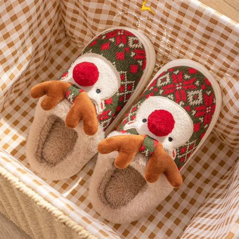 Cozy elk-themed Christmas slippers in green and red colors, featuring a plush, fuzzy design and non-slip sole for comfortable indoor wear