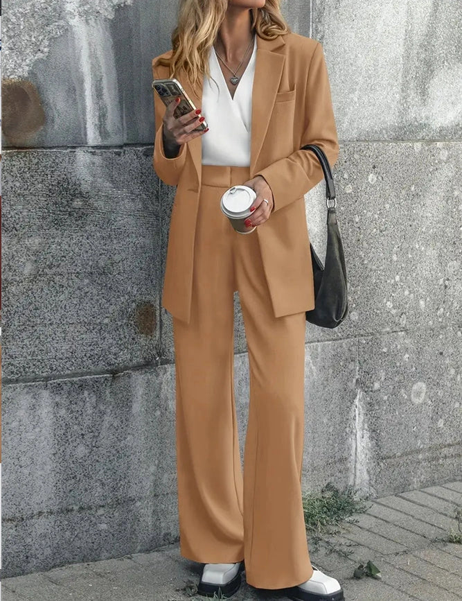 Tailored ladies' suit in various colours, featuring a jacket and trousers made of premium polyester fabric.