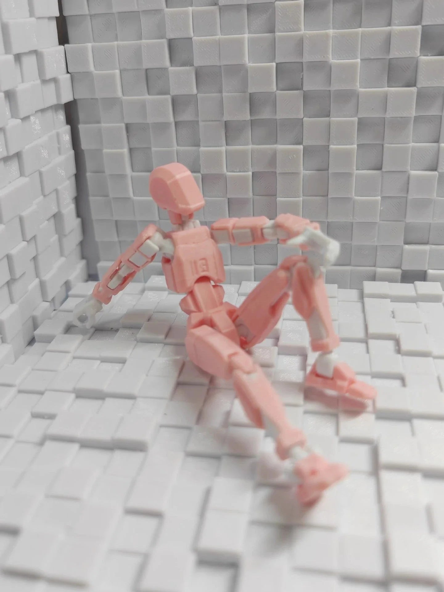 Customizable 3D printed multi-jointed action figure robot toy in various vibrant colors