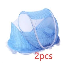 Breathable insect-free foldable baby travel cot with integrated mattress and pillow, available in blue, pink and blue-and-pink colour options