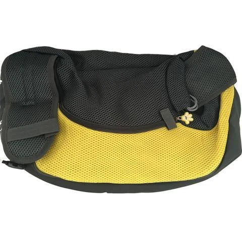 A comfortable and stylish pet sling bag with padded mesh and leather details, allowing hands-free travel for pet owners.