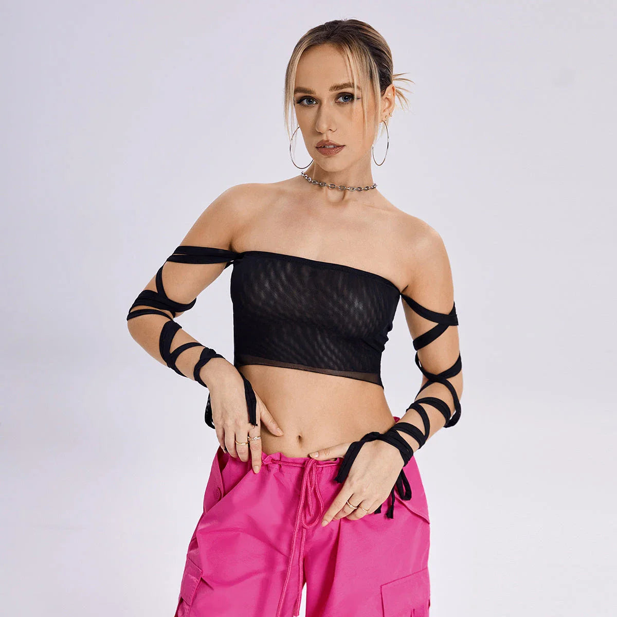 A stylish women's tank top with a trendy cross-back design and premium fabric blend for comfortable and versatile summer wear.