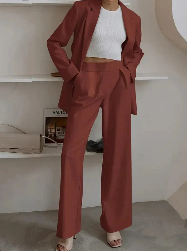 Tailored ladies' suit in various colours, featuring a jacket and trousers made of premium polyester fabric.