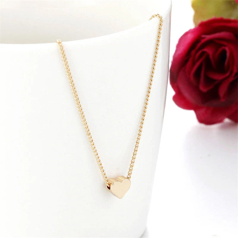 A stylish double-sided love pendant necklace made of premium alloy and featuring a chic geometric design, perfect for elevating any outfit.
