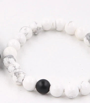 Handcrafted beaded bracelet with seven chakra-representing beads, designed to promote balance and well-being.