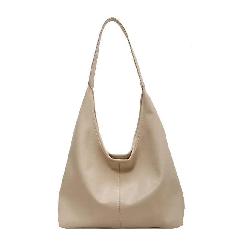 Classic vintage-inspired women's shoulder bag in a range of sophisticated colours, featuring a roomy interior, adjustable strap, and premium materials for timeless British style.