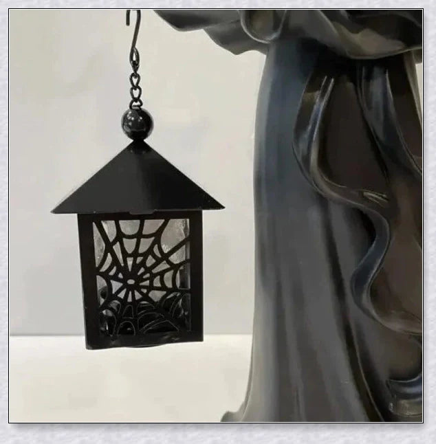 Witch With Lantern Decoration - A premium resin figurine that casts a mesmerising glow, adding enchantment to any space.