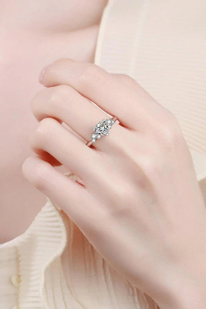 Elegant 1 carat moissanite heart-shaped ring with sterling silver setting and zircon accents
