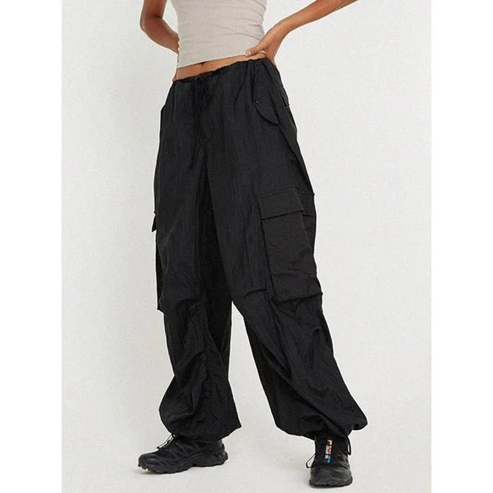 High-waist safari-style cargo trousers in black, featuring a comfortable, relaxed fit and unique design elements