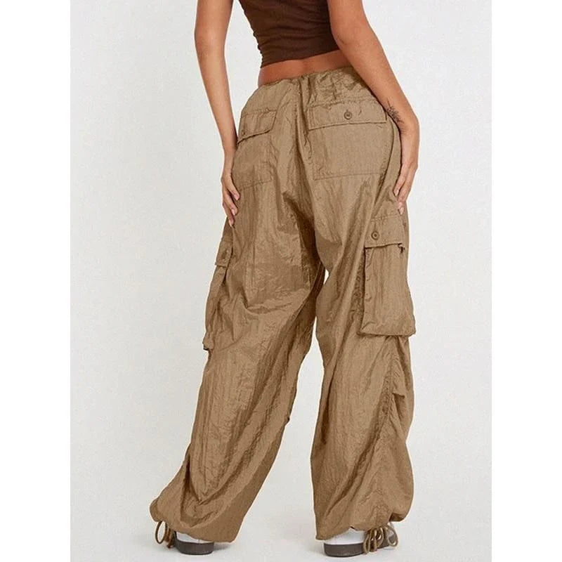 High-waist safari-style cargo trousers in black, featuring a comfortable, relaxed fit and unique design elements