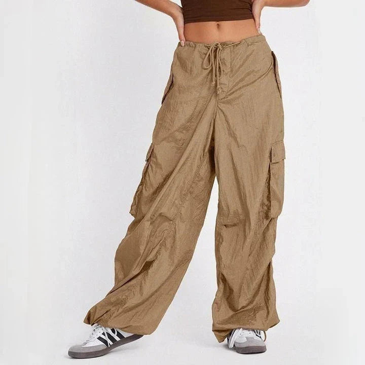 High-waist safari-style cargo trousers in black, featuring a comfortable, relaxed fit and unique design elements