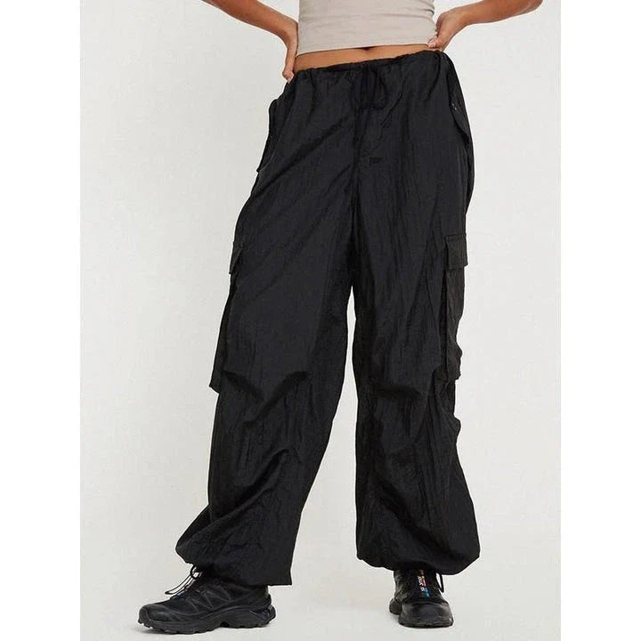 High-waist safari-style cargo trousers in black, featuring a comfortable, relaxed fit and unique design elements