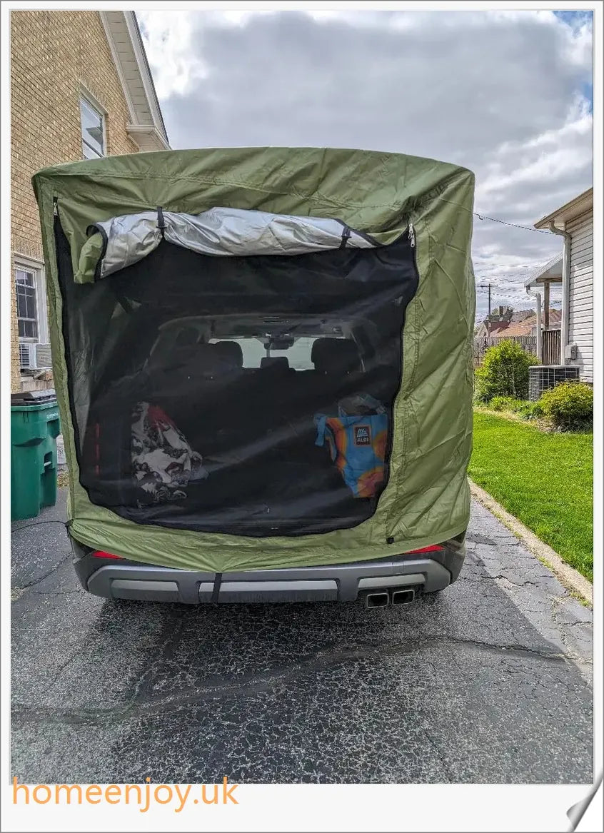 Weatherproof and versatile car trunk extension tent for outdoor adventures, with dual-layer design and secure magnetic fit