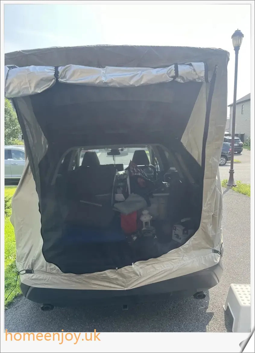 Weatherproof and versatile car trunk extension tent for outdoor adventures, with dual-layer design and secure magnetic fit