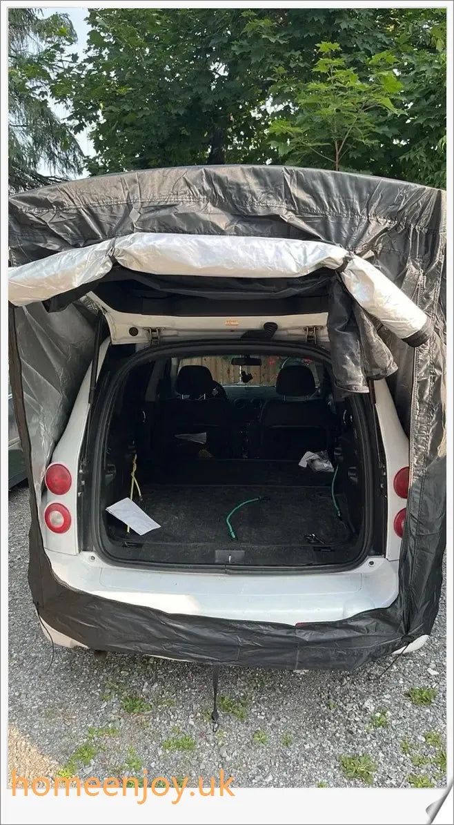 Weatherproof and versatile car trunk extension tent for outdoor adventures, with dual-layer design and secure magnetic fit