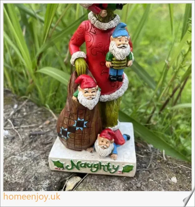 A resin garden statue depicting the Grinch sneakily enjoying a snack, surrounded by a group of jolly gnomes.