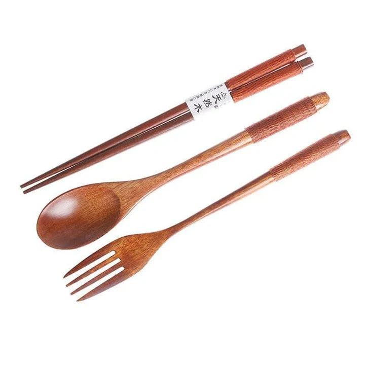 A portable wooden cutlery set with a coordinating cloth bag, perfect for outdoor dining and travel.