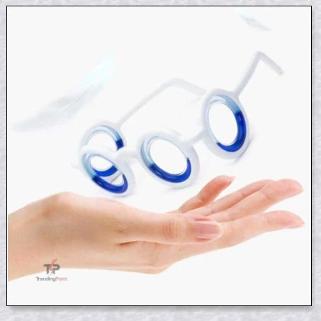 A pair of black motion sickness glasses with a blue liquid-filled ring to create an artificial horizon and relieve nausea, dizziness, and vertigo during travel.