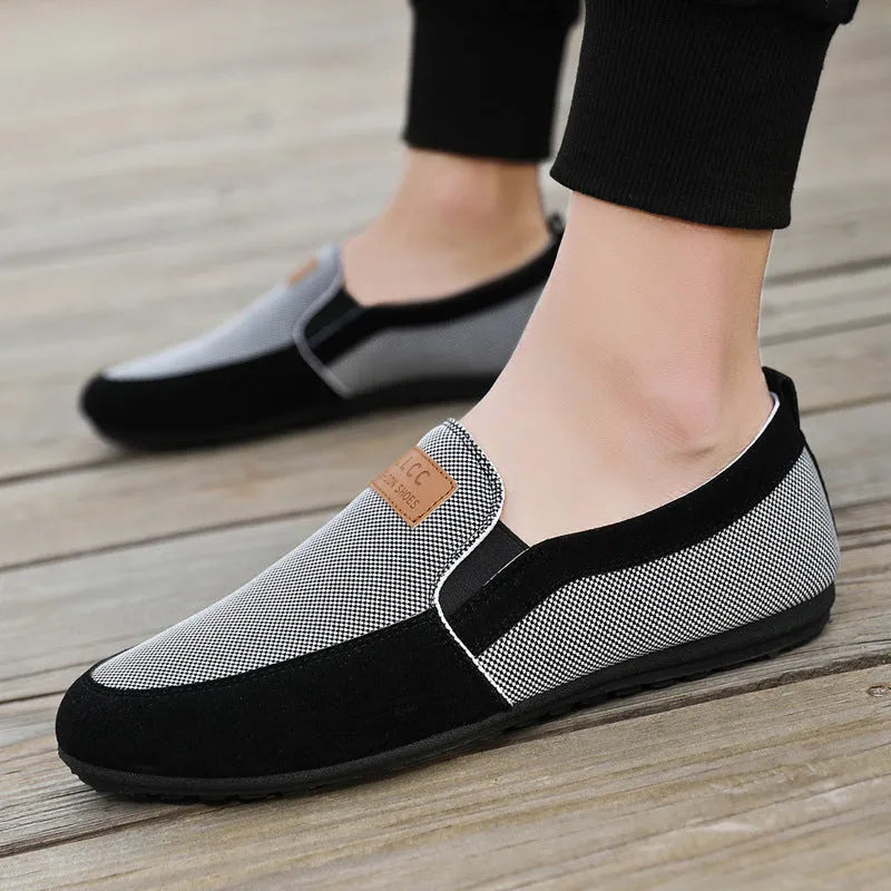 Men's grey canvas lace-up casual shoes with a round toe and rubber sole.