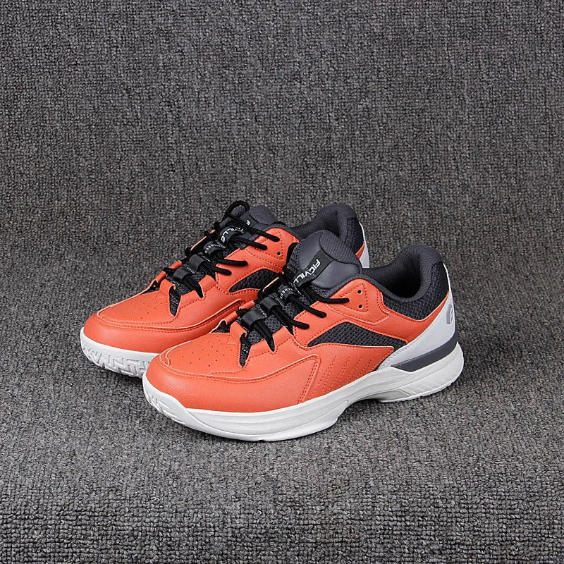 Orange men's wide fit tennis shoes with suede and mesh upper, lace-up closure, and rubber outsole.