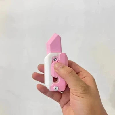 3D printed carrot-shaped fidget knife with gravity-powered hidden blade for stress relief and entertainment