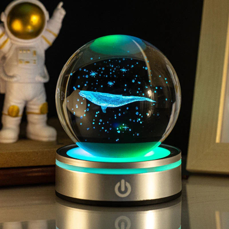 Luminous crystal ball with various celestial-inspired designs, including the Milky Way, Solar System, and Constellation.