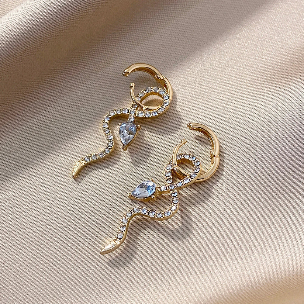 Elegant gold snake dangle earrings with a captivating serpentine design