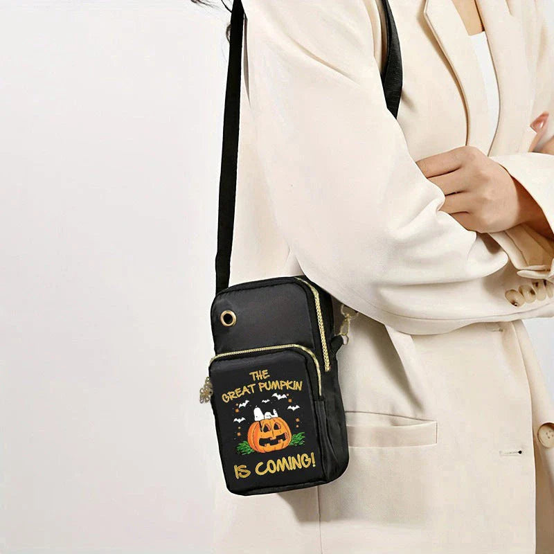 A black crossbody bag with a pumpkin pattern, perfect for Halloween celebrations and everyday use.